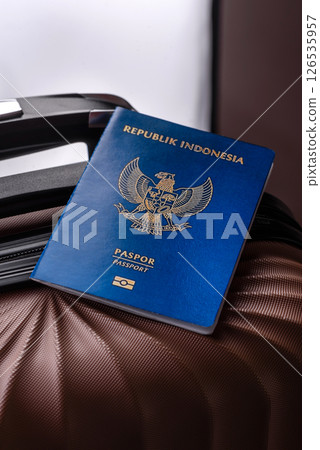 International passport of a citizen of Indonesia on a suitcase 126535957