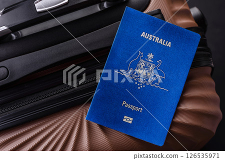 International passport of a citizen of Australia on a suitcase 126535971