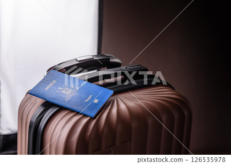 International passport of a citizen of Australia on a suitcase International passport of a citizen of Australia on a suitcase 126535978