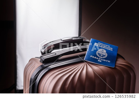 International passport of a citizen of Argentina on a suitcase 126535982