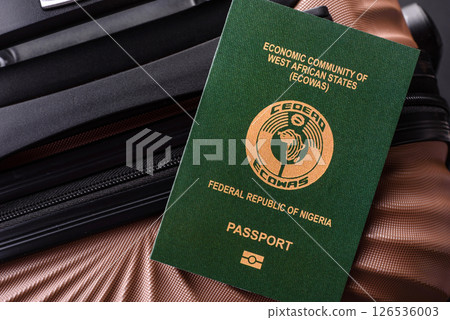 International passport of a citizen of Nigeria on a suitcase International passport of a citizen of Nigeria on a suitcase 126536003