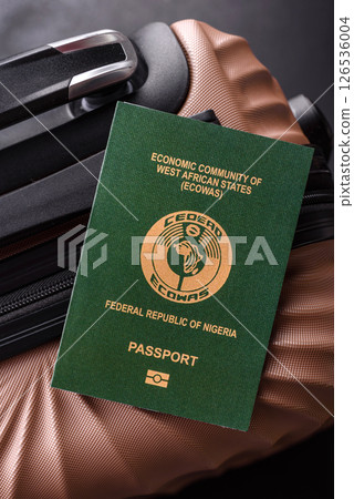 International passport of a citizen of Nigeria on a suitcase International passport of a citizen of Nigeria on a suitcase 126536004