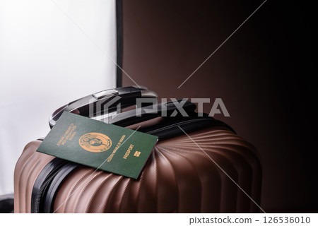 International passport of a citizen of Nigeria on a suitcase 126536010