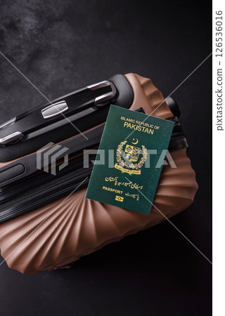 International passport of a citizen of Pakistan on a suitcase International passport of a citizen of Pakistan on a suitcase 126536016