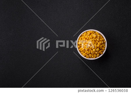 Sweet yellow canned corn in bowl 126536038