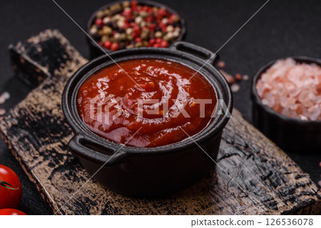 Red sauce or ketchup with salt and spices in ceramic sauce boat Red sauce or ketchup with salt and spices in ceramic sauce boat 126536078