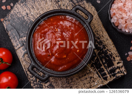 Red sauce or ketchup with salt and spices in ceramic sauce boat Red sauce or ketchup with salt and spices in ceramic sauce boat 126536079