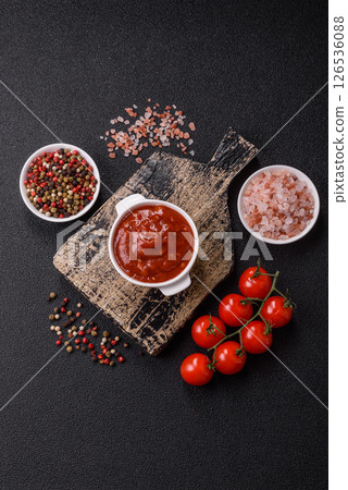 Red sauce or ketchup with salt and spices in ceramic sauce boat Red sauce or ketchup with salt and spices in ceramic sauce boat 126536088