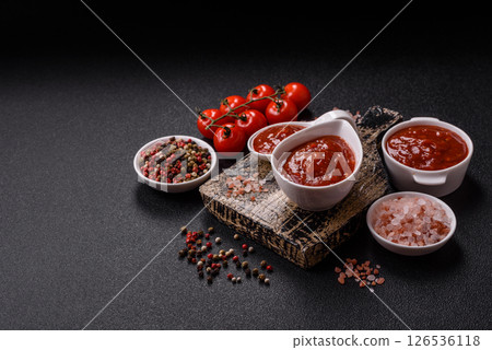 Red sauce or ketchup with salt and spices in ceramic sauce boat Red sauce or ketchup with salt and spices in ceramic sauce boat 126536118