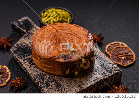 Round puff pastry croissant with pistachio filling or new york roll Round puff pastry croissant with pistachio filling or new york roll 126536138