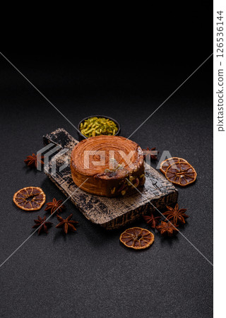 Round puff pastry croissant with pistachio filling or new york roll 126536144