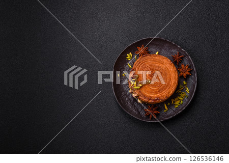 Round puff pastry croissant with pistachio filling or new york roll Round puff pastry croissant with pistachio filling or new york roll 126536146