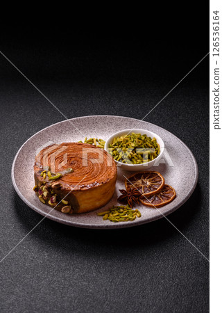 Round puff pastry croissant with pistachio filling or new york roll 126536164