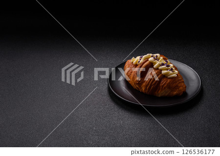 Sweet crispy fresh croissant with berry filling 126536177