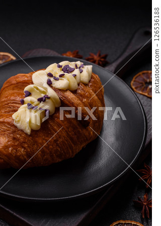 Sweet crispy fresh croissant with berry filling 126536188