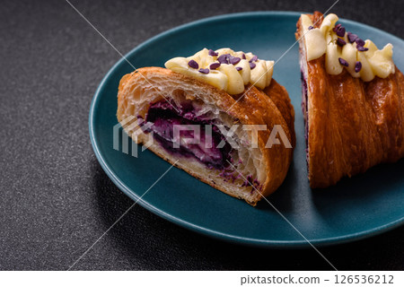 Sweet crispy fresh croissant with berry filling 126536212