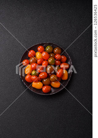 Tomatoes of different colors as a vegetable meal 126536425