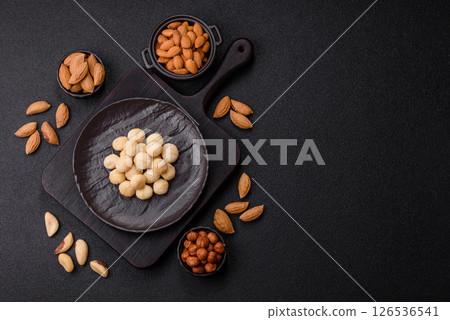 Raw peeled macadamia nut in ceramic bowl Raw peeled macadamia nut in ceramic bowl 126536541