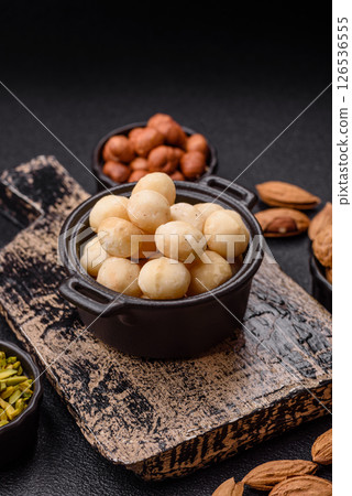 Raw peeled macadamia nut in ceramic bowl Raw peeled macadamia nut in ceramic bowl 126536555