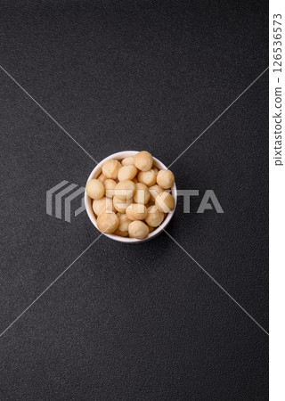 Raw peeled macadamia nut in ceramic bowl Raw peeled macadamia nut in ceramic bowl 126536573