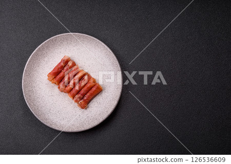 Cheese and meat, jamon or prosciutto rolled into a roll 126536609