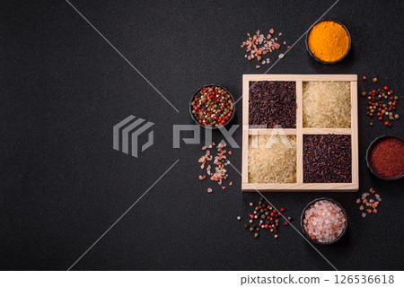 White and red raw rice grains in a ceramic bowl. Rice as an ingredient 126536618