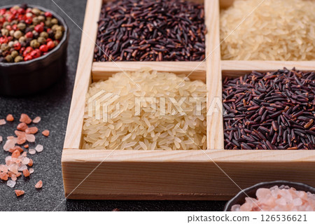 White and red raw rice grains in a ceramic bowl. Rice as an ingredient 126536621