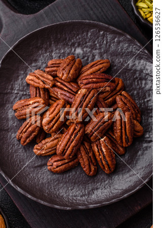 Nut, pecans in a ceramic bowl, an ingredient in vegan food 126536627