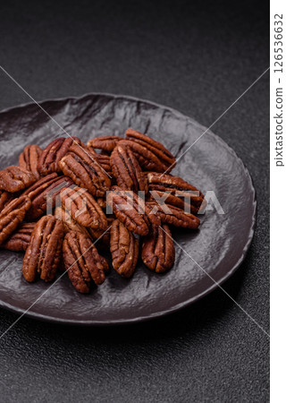 Nut, pecans in a ceramic bowl, an ingredient in vegan food 126536632