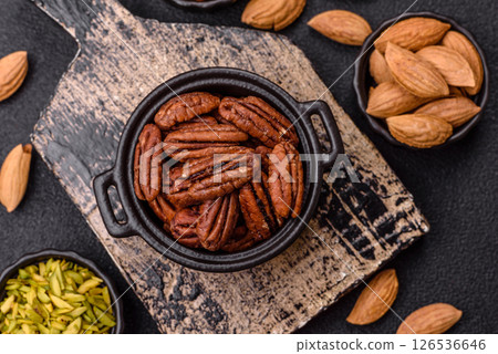 Nut, pecans in a ceramic bowl, an ingredient in vegan food 126536646