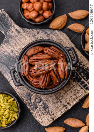 Nut, pecans in a ceramic bowl, an ingredient in vegan food Nut, pecans in a ceramic bowl, an ingredient in vegan food 126536647