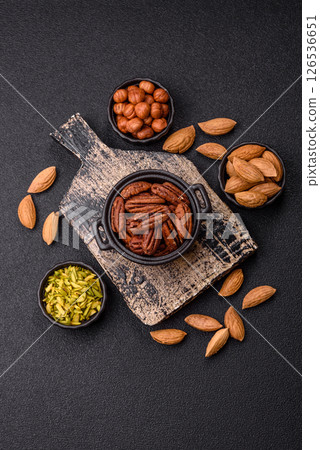 Nut, pecans in a ceramic bowl, an ingredient in vegan food 126536651