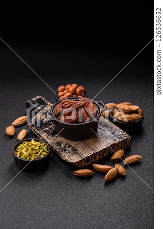 Nut, pecans in a ceramic bowl, an ingredient in vegan food Nut, pecans in a ceramic bowl, an ingredient in vegan food 126536652