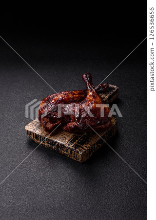Duck, chicken leg or thigh grilled on a dark concrete background Duck, chicken leg or thigh grilled on a dark concrete background 126536656