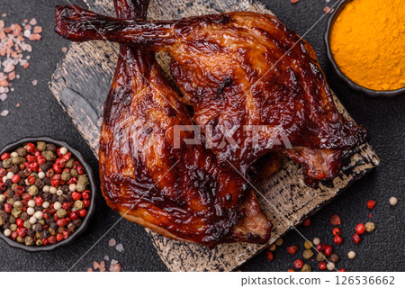 Duck, chicken leg or thigh grilled on a dark concrete background Duck, chicken leg or thigh grilled on a dark concrete background 126536662