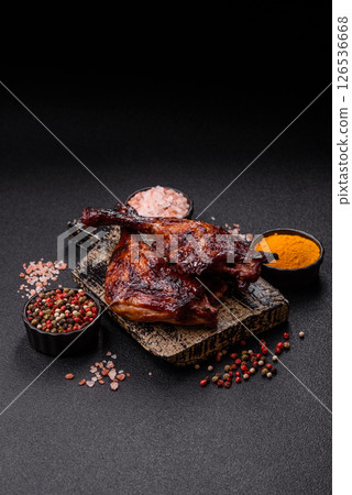Duck, chicken leg or thigh grilled on a dark concrete background Duck, chicken leg or thigh grilled on a dark concrete background 126536668