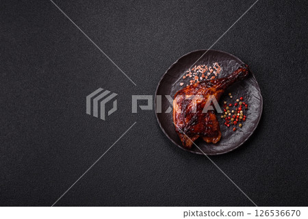 Duck, chicken leg or thigh grilled on a dark concrete background Duck, chicken leg or thigh grilled on a dark concrete background 126536670