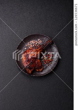 Duck, chicken leg or thigh grilled on a dark concrete background Duck, chicken leg or thigh grilled on a dark concrete background 126536671