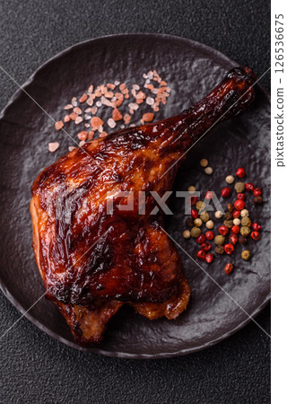 Duck, chicken leg or thigh grilled on a dark concrete background Duck, chicken leg or thigh grilled on a dark concrete background 126536675