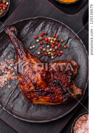 Duck, chicken leg or thigh grilled on a dark concrete background Duck, chicken leg or thigh grilled on a dark concrete background 126536679