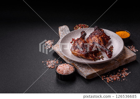 Duck, chicken leg or thigh grilled on a dark concrete background Duck, chicken leg or thigh grilled on a dark concrete background 126536685