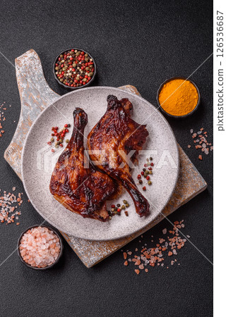 Duck, chicken leg or thigh grilled on a dark concrete background 126536687