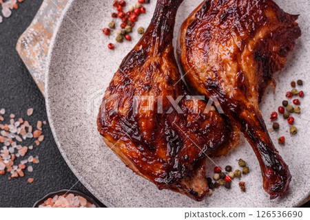 Duck, chicken leg or thigh grilled on a dark concrete background 126536690