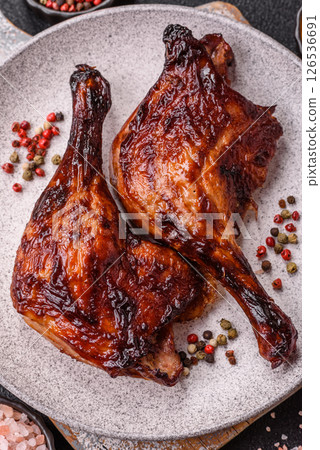 Duck, chicken leg or thigh grilled on a dark concrete background Duck, chicken leg or thigh grilled on a dark concrete background 126536691
