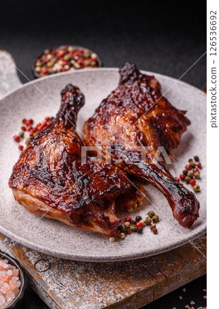 Duck, chicken leg or thigh grilled on a dark concrete background 126536692