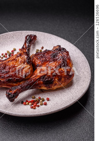 Duck, chicken leg or thigh grilled on a dark concrete background Duck, chicken leg or thigh grilled on a dark concrete background 126536696