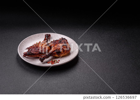Duck, chicken leg or thigh grilled on a dark concrete background Duck, chicken leg or thigh grilled on a dark concrete background 126536697