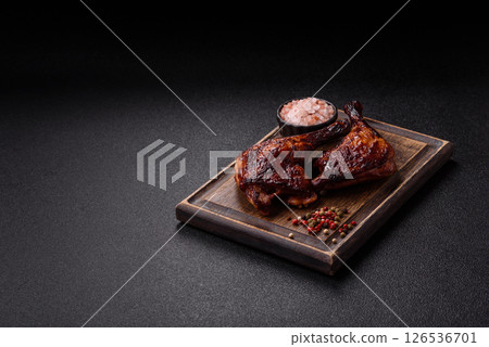 Duck, chicken leg or thigh grilled on a dark concrete background Duck, chicken leg or thigh grilled on a dark concrete background 126536701