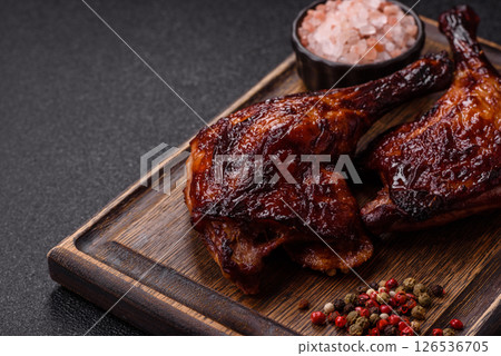 Duck, chicken leg or thigh grilled on a dark concrete background Duck, chicken leg or thigh grilled on a dark concrete background 126536705