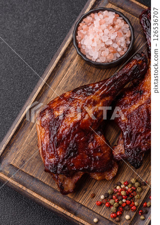 Duck, chicken leg or thigh grilled on a dark concrete background Duck, chicken leg or thigh grilled on a dark concrete background 126536707